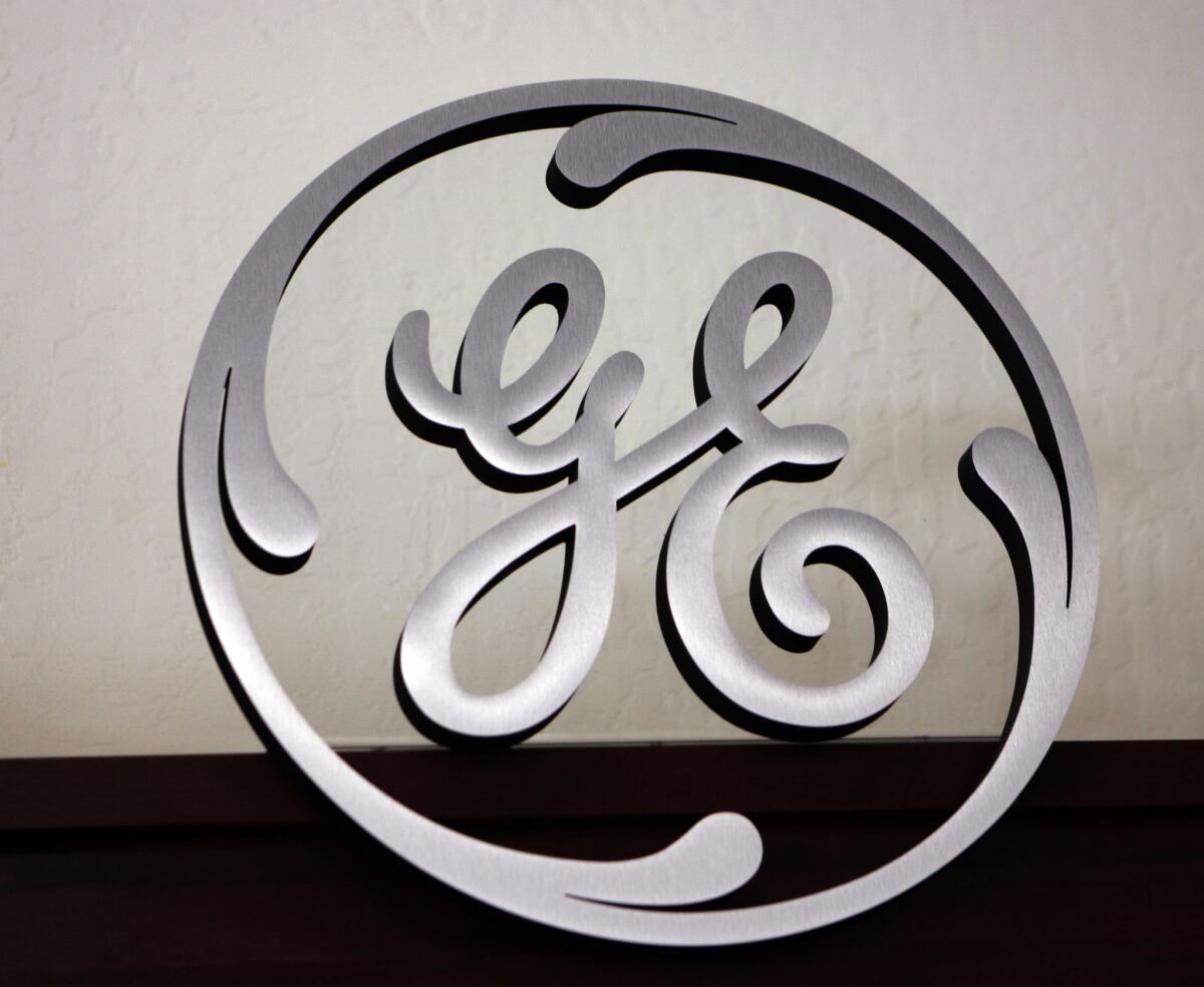 A General Electric sign is displayed at an appliance store in Mountain View, Calif.