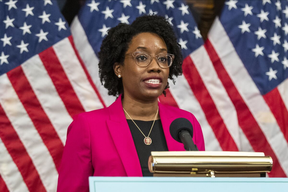 FILE - Rep. Lauren Underwood, D-Ill., speaks during a news conference June 24, 2020 in Washington. U.S. Rep. Lauren Underwood of Illinois had surgery Thursday, Nov. 11, 2021 in Chicago to remove uterine fibroids and will spend the “coming weeks” recovering in Illinois, her office said. (AP Photo/Manuel Balce Ceneta, File)