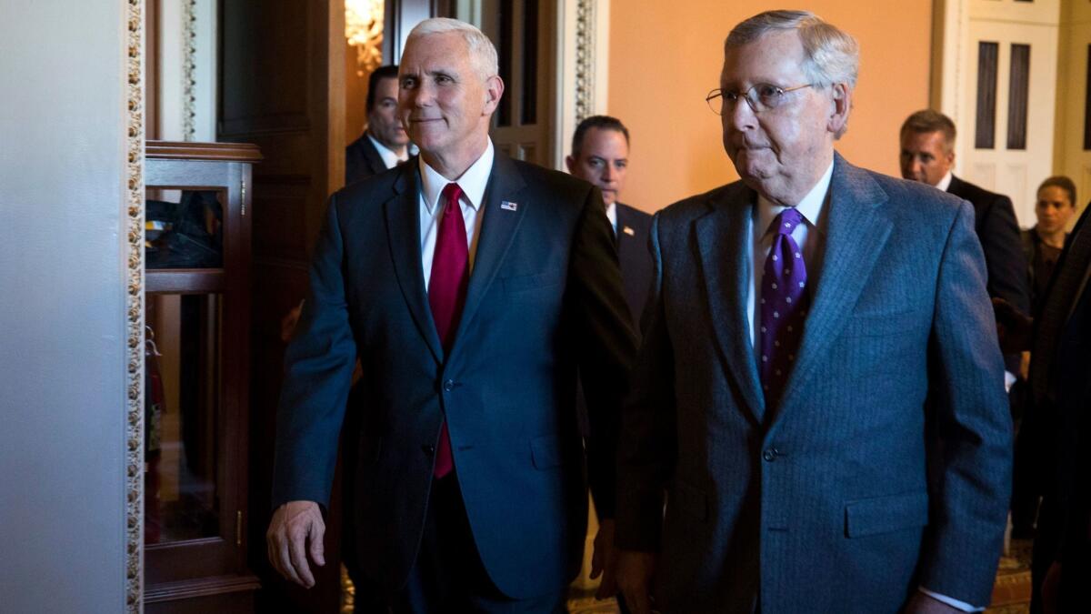 Vice President-elect Mike Pence and Republican Senate Majority Leader from Kentucky Mitch McConnell prepare to speak to the media about Republican efforts to repeal Obamacare on Jan. 4.