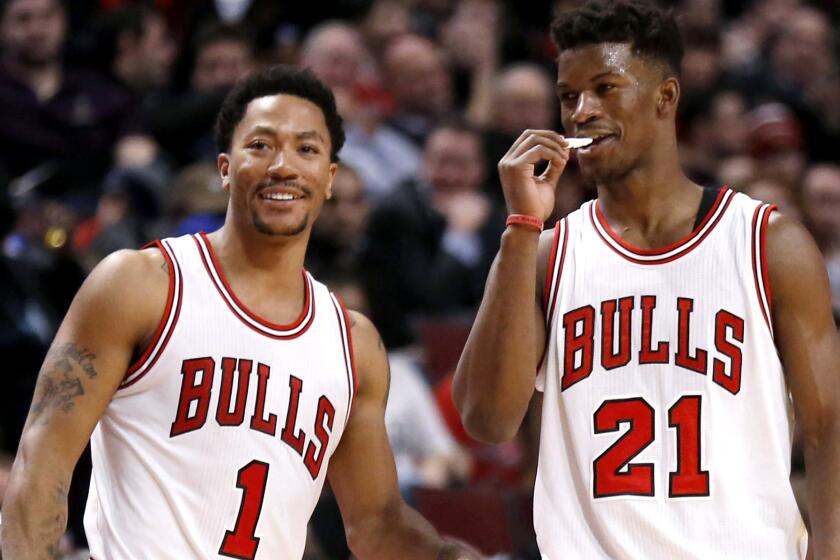 Jimmy Butler (21) and the Bulls will try to hold their playoff position until the hopeful return of point guard Derrick Rose.