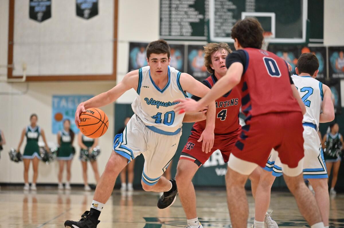 Cooper Stearns of Irvine High drives around a screen set by a teammate during a recent game.