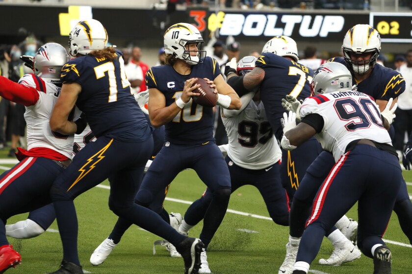 Chargers quarterback Justin Herbert looks to pass in the fourth quarter of a 27-24 loss to the New England Patriots.