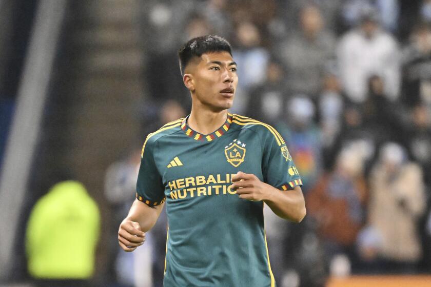 Los Angeles Galaxy midfielder Daniel Aguirre (37) runs down field during an MLS soccer match against Sporting Kansas City, Saturday, March 11, 2023, in Kansas City, Kan. (AP Photo/Peter Aiken)