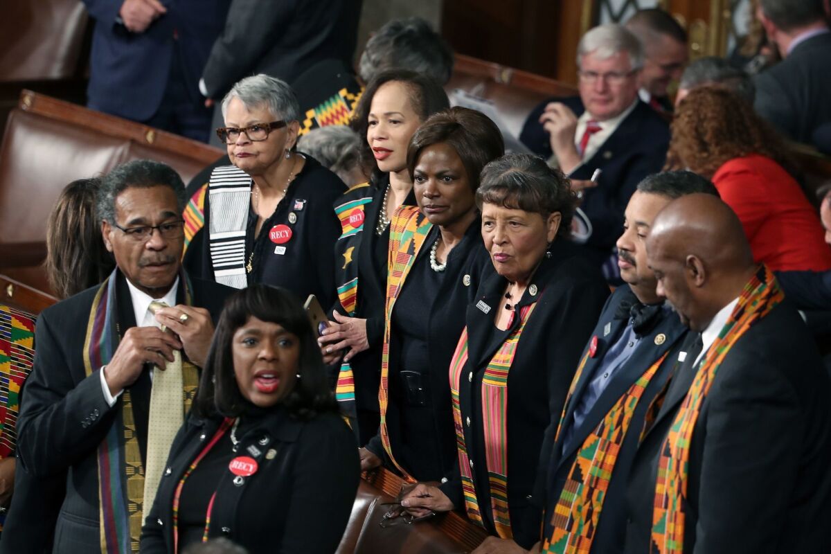 Members of the Congressional Black Caucus wear black clothing and Kente cloth for the State of the Union address Tuesday in Washington.