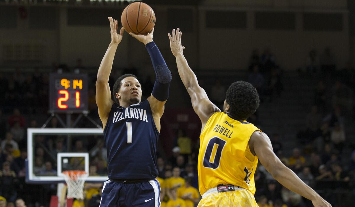 Villanova's Jalen Brunson (1) shoots the ball against La Salle's Pookie Powell (0) in the first half on Tuesday.