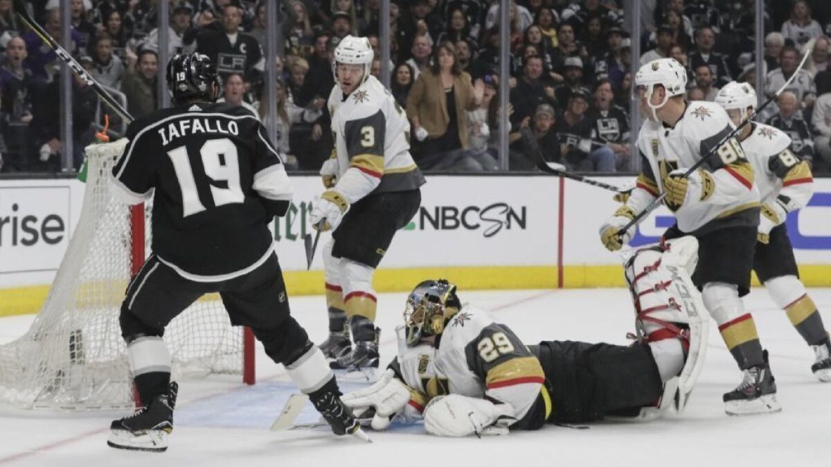 Kings center Alex Iafollo scores on Golden Knights goaltender Marc-Andre Fleury during the first period of Game 3 on Sunday at Staples Center.