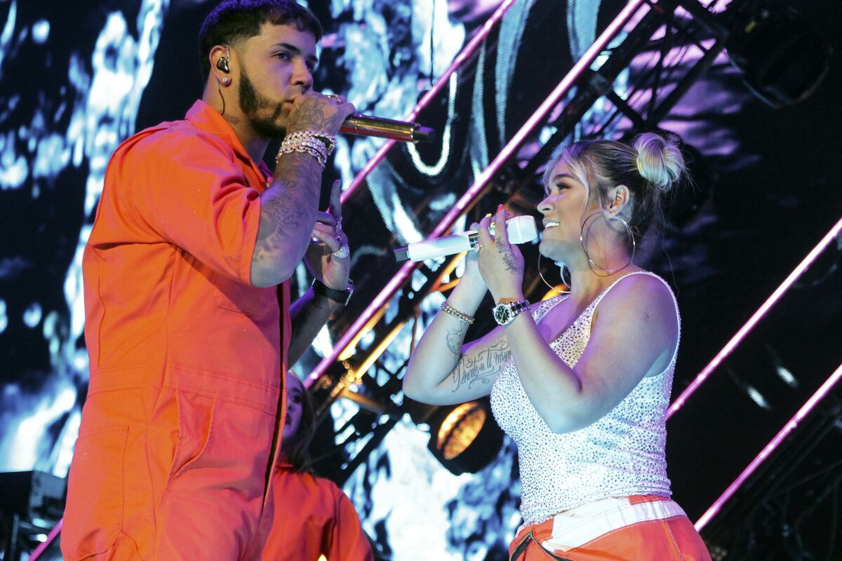 Anuel AA and Karol G perform in Mexico City in 2019.