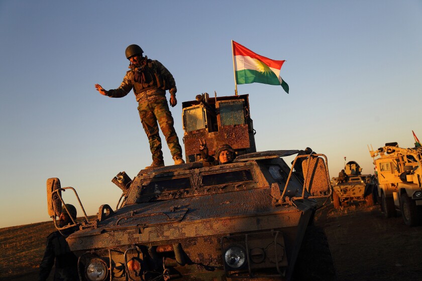 Iraqi peshmerga fighters prepare to retake the Islamic State-occupied town of Sinjar on Nov. 12.