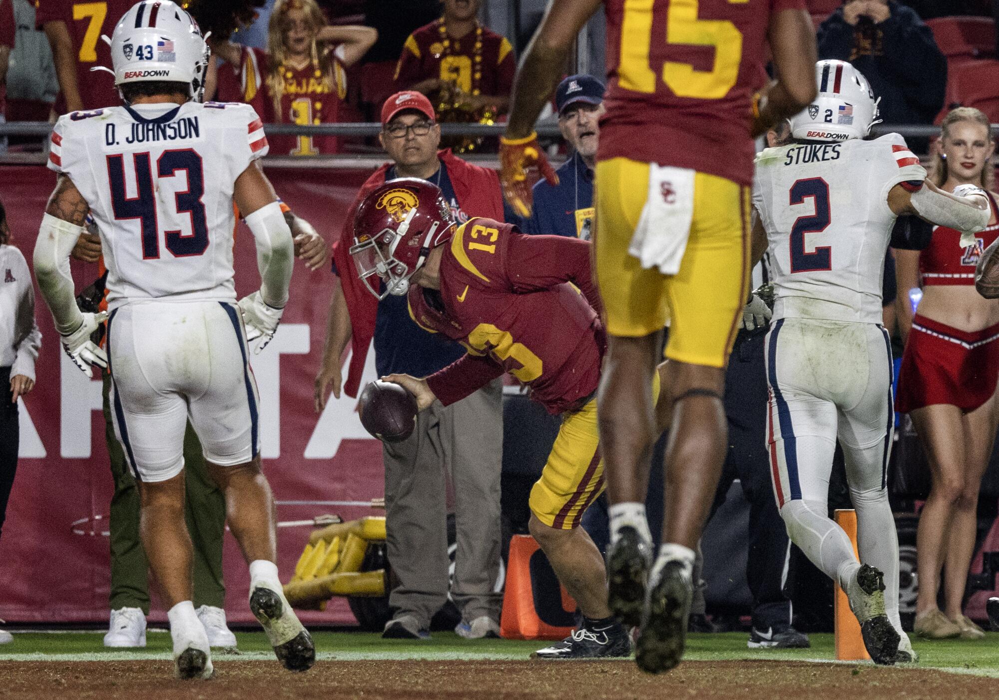 USC quarterback Caleb Williams leans across the goal line for the game-winning two-point conversion Saturday.