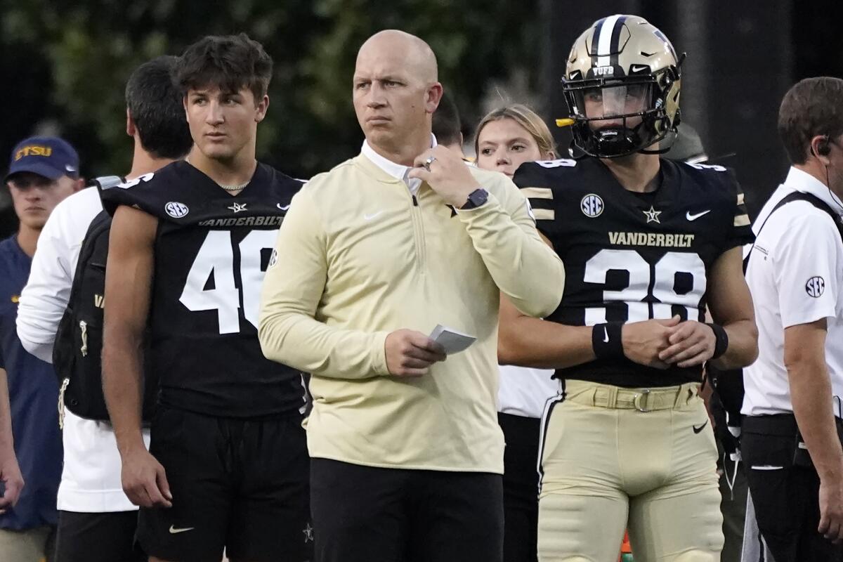 First year Vanderbilt head coach Clark Lea watches as his players warm up before an NCAA college football game against East Tennessee State Saturday, Sept. 4, 2021, in Nashville, Tenn. (AP Photo/Mark Humphrey)