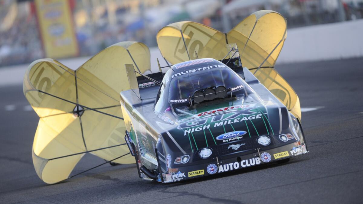 John Force competes in NHRA funny car qualifying at the Midwest Nationals in Madison, Ill., on Sept. 27.
