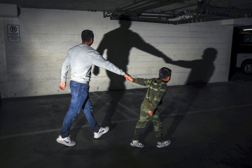 Los Angeles, CA - May 24: Santiago, a 6-year-old Colombian boy, is an asylum seeker who now face deportation after he and his father William, 42, missed their court dates through no fault of their own. Father and son photographed at an undisclosed location on Tuesday, May 24, 2022 in Los Angeles, CA. (Irfan Khan / Los Angeles Times)
