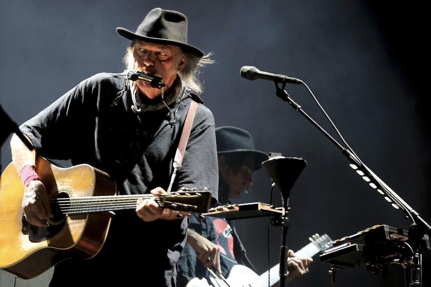 Veteran rocker Neil Young, shown performing in Indio in October at the Desert Trip rock festival, is releasing a new studio album, "Peace Trail," on Friday.