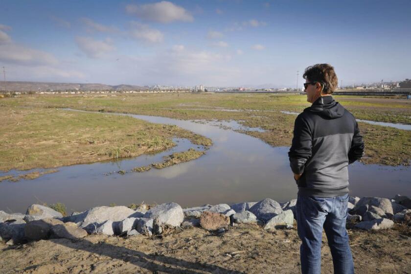In this 2018 photo, Imperial Beach Mayor Serge Dedina surveys the Tijuana River Valley.