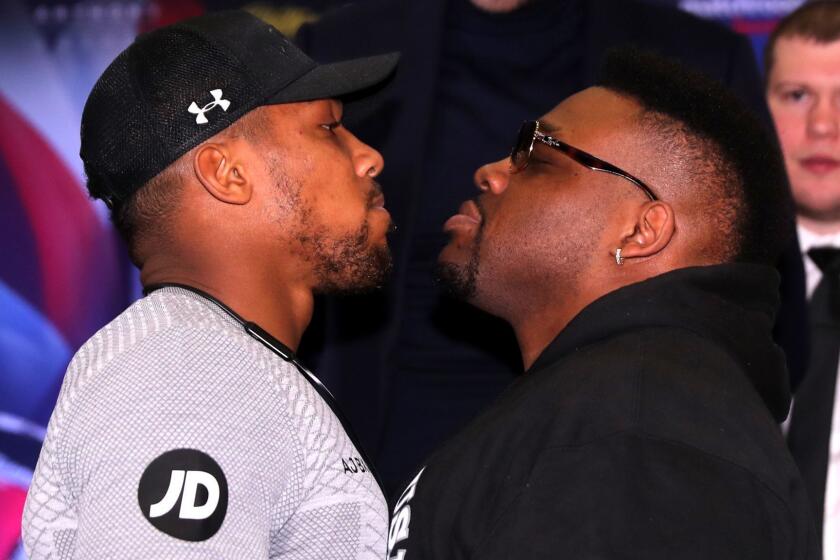 LONDON, ENGLAND - FEBRUARY 25: Anthony Joshua and Jarrell Miller square up during an Anthony Joshua and Jarrell Miller Press Conference ahead of their fight in September 2019 for the IBF, WBA and WBO heavyweight titles at Hilton London Syon Park on February 25, 2019 in London, England. (Photo by Richard Heathcote/Getty Images) ** OUTS - ELSENT, FPG, CM - OUTS * NM, PH, VA if sourced by CT, LA or MoD **