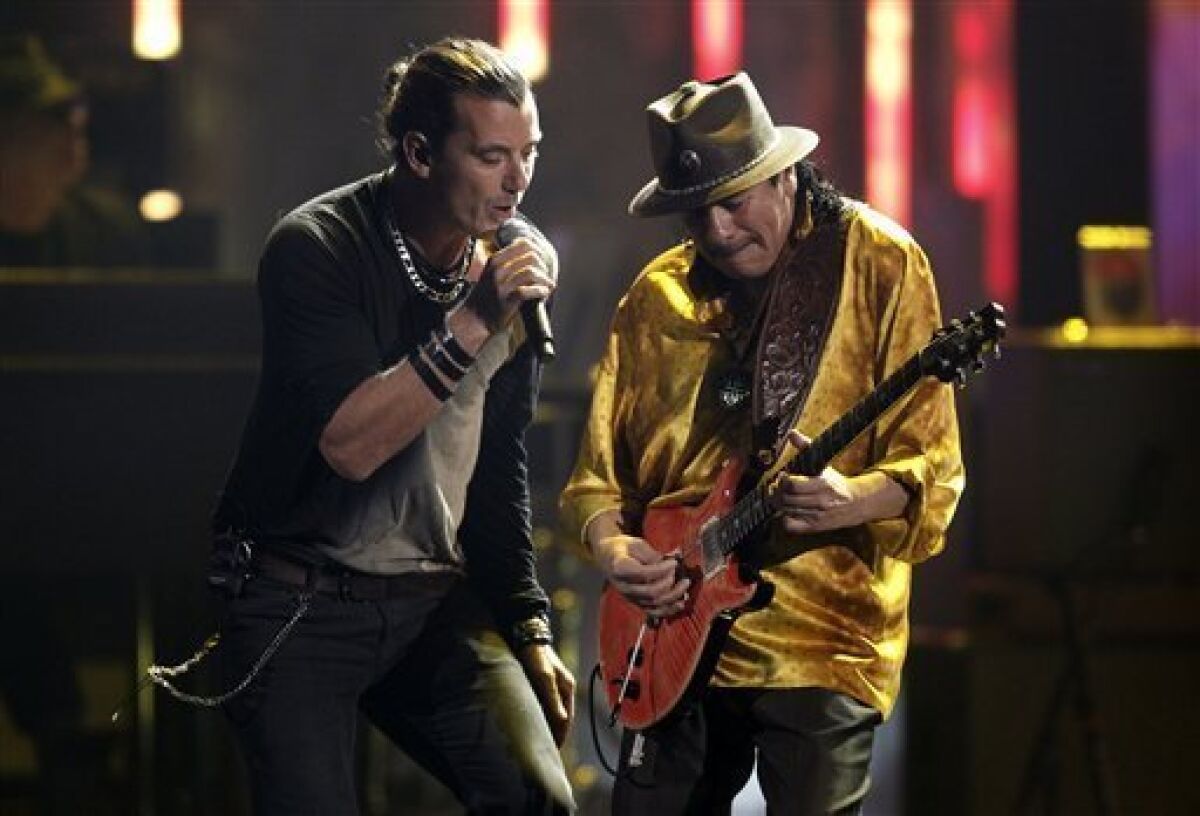 Gavin Rossdale, the leader of the band Bush, is shown performing with former Tijuana guitarist Carlos Santana at the 38th Annual American Music Awards telecast. Rossdale and his band have just announced a new fall leg of their joint tour with fellow band Live that will begin in San Diego.
