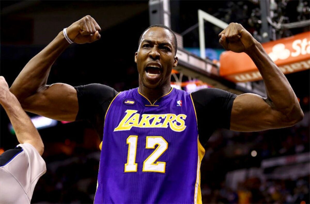 Lakers' Dwight Howard flexes after being fouled during a game against the San Antonio Spurs.