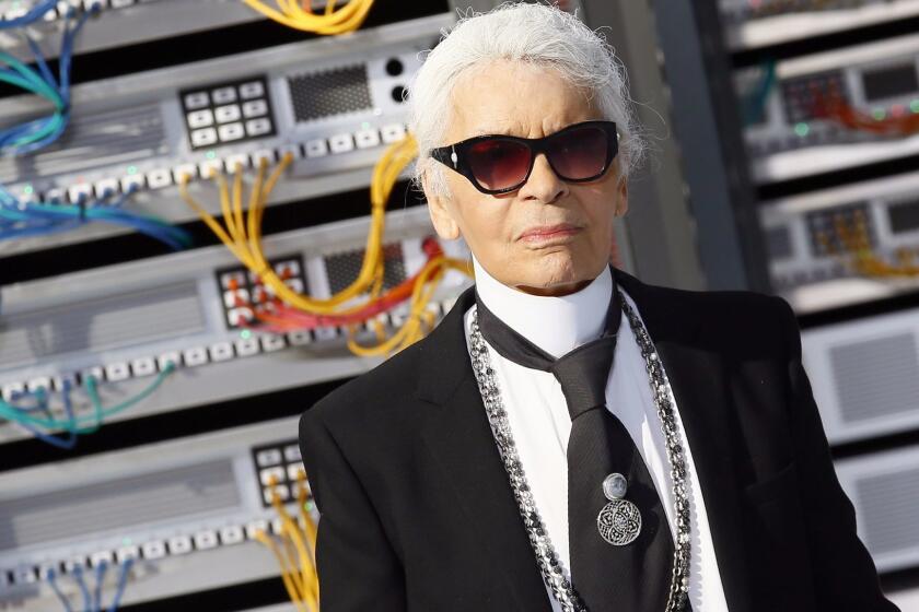 Copyright 2016 The Associated Press. All rights reserved. This material may not be published, broadcast, rewritten or redistributed without permission. Mandatory Credit: Photo by Francois Mori/AP/REX/Shutterstock (6072682ad) Fashion designer Karl Lagerfeld appears at the end of the presentation of Chanel's Spring-Summer 2017 ready-to-wear fashion collection presented Tuesday, Oct.4, 2016 in Paris Chanel show, Spring Summer 2017, Paris Fashion Week, France - 04 Oct 2016