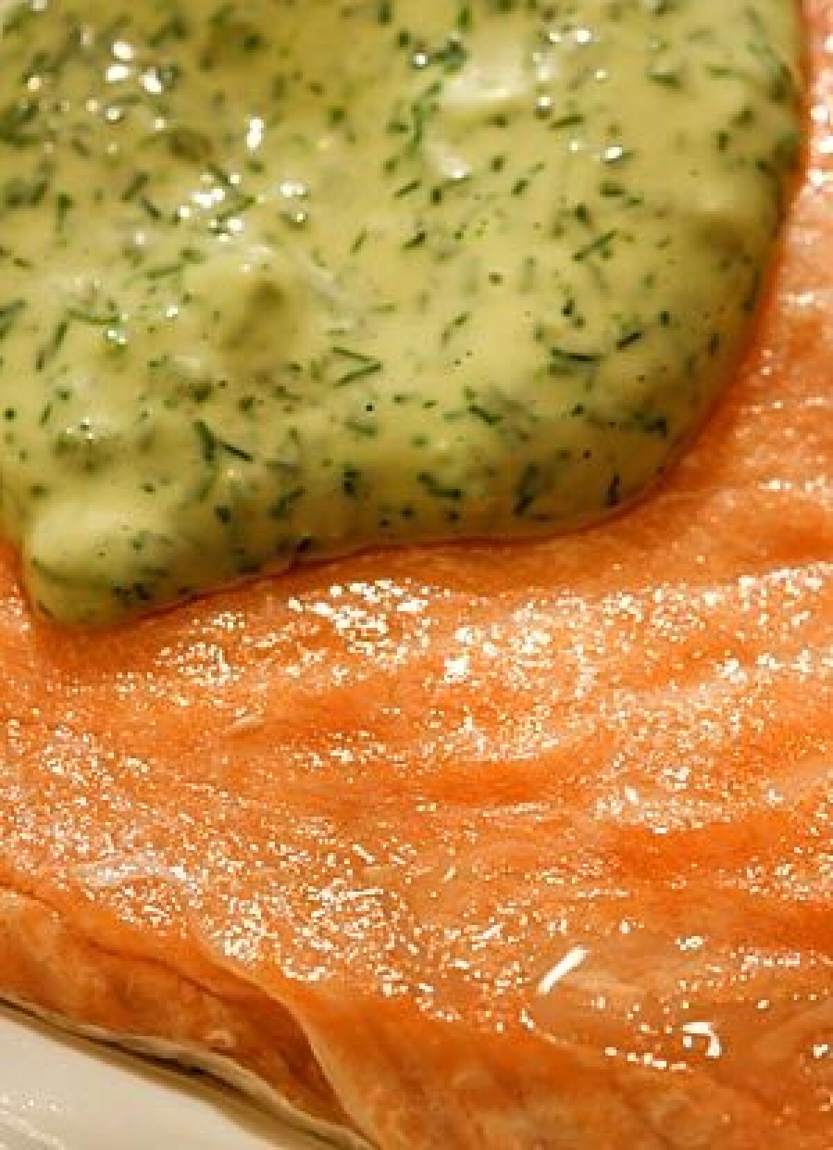 Oven-steamed salmon with dill sauce.