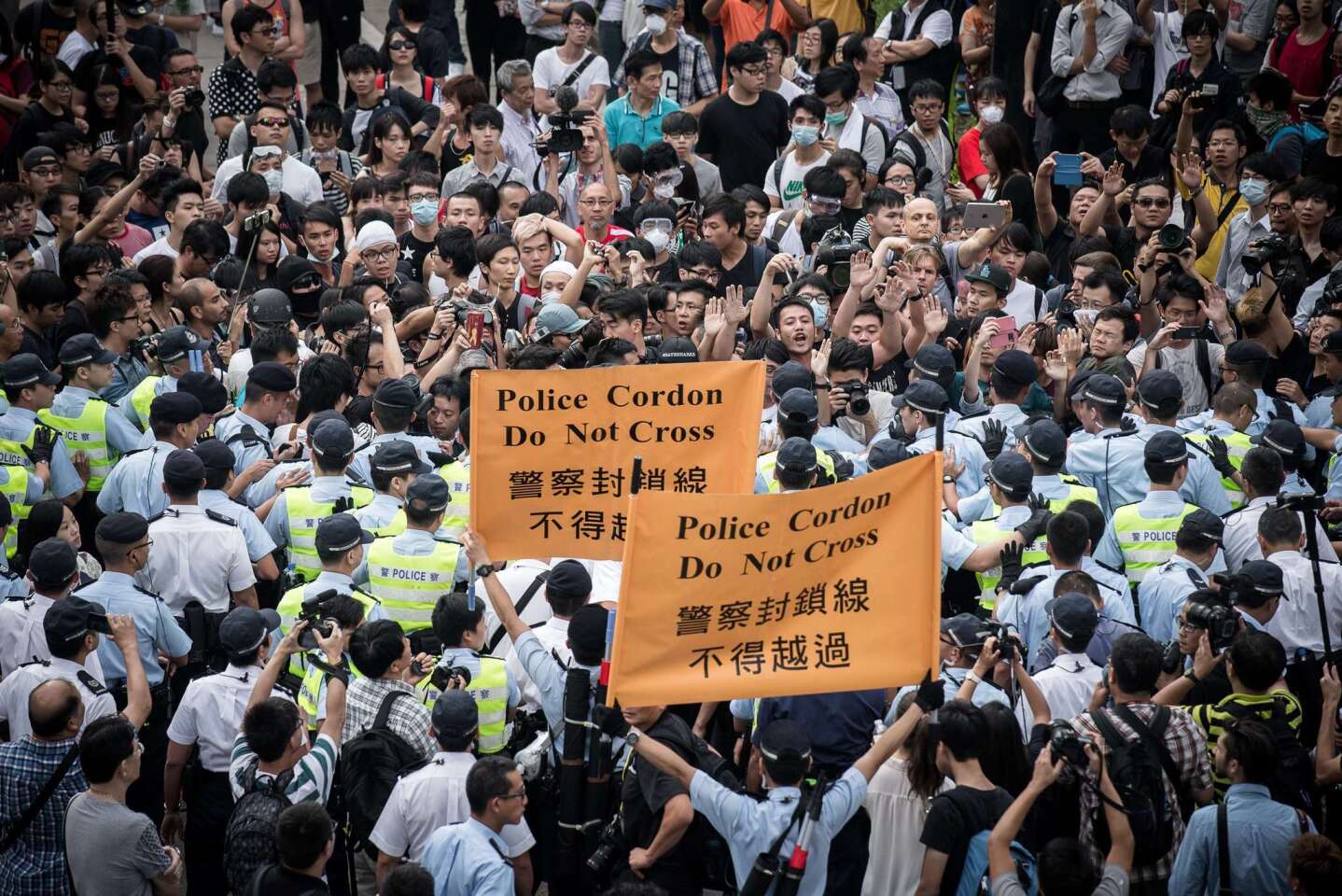 Police cordon an area where pro-democracy demonstrators confront those protesting them in the Admiralty district of Hong Kong on Oct. 13.