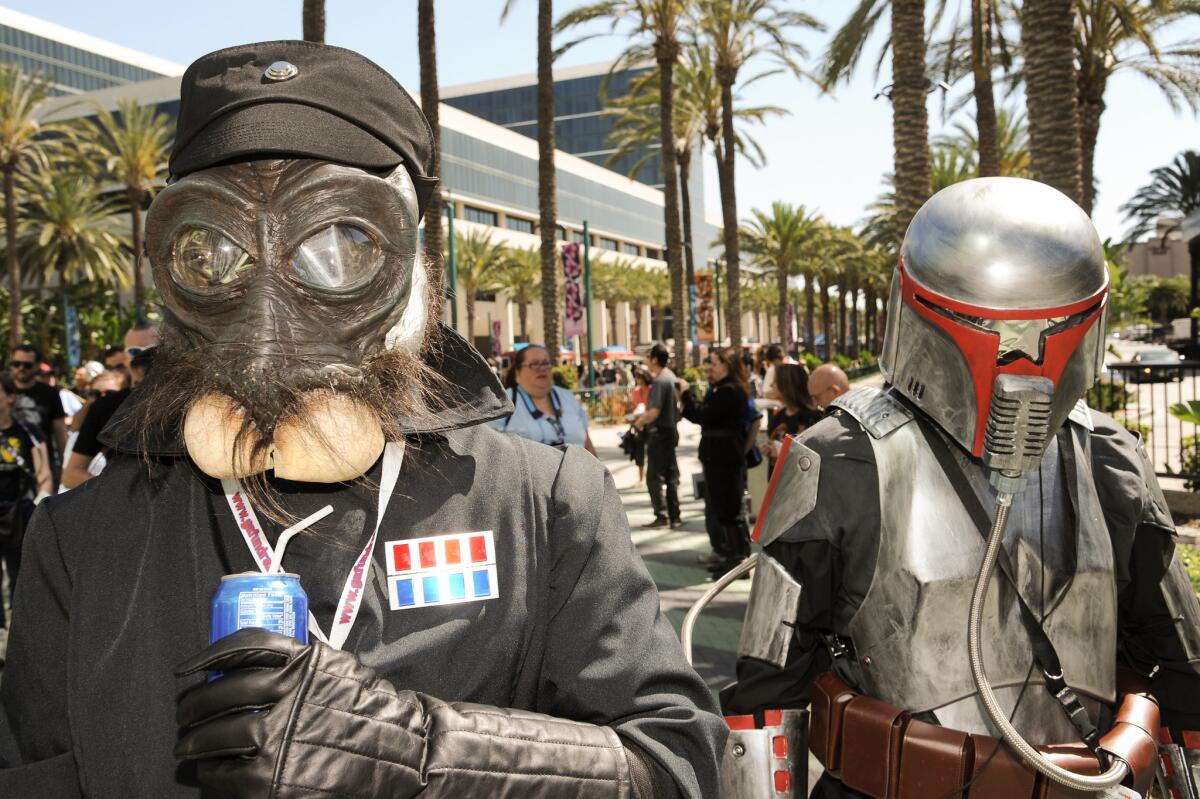 Star Wars fans wait in line to enter the Star Wars Celebration fan expo at the Anaheim Convention Center on April 16.