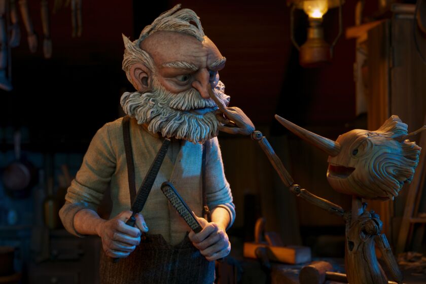 Guillermo del Toro's Pinocchio - (L-R) Gepetto (voiced by David Bradley) and Pinocchio (voiced by Gregory Mann). Cr: Netflix © 2022