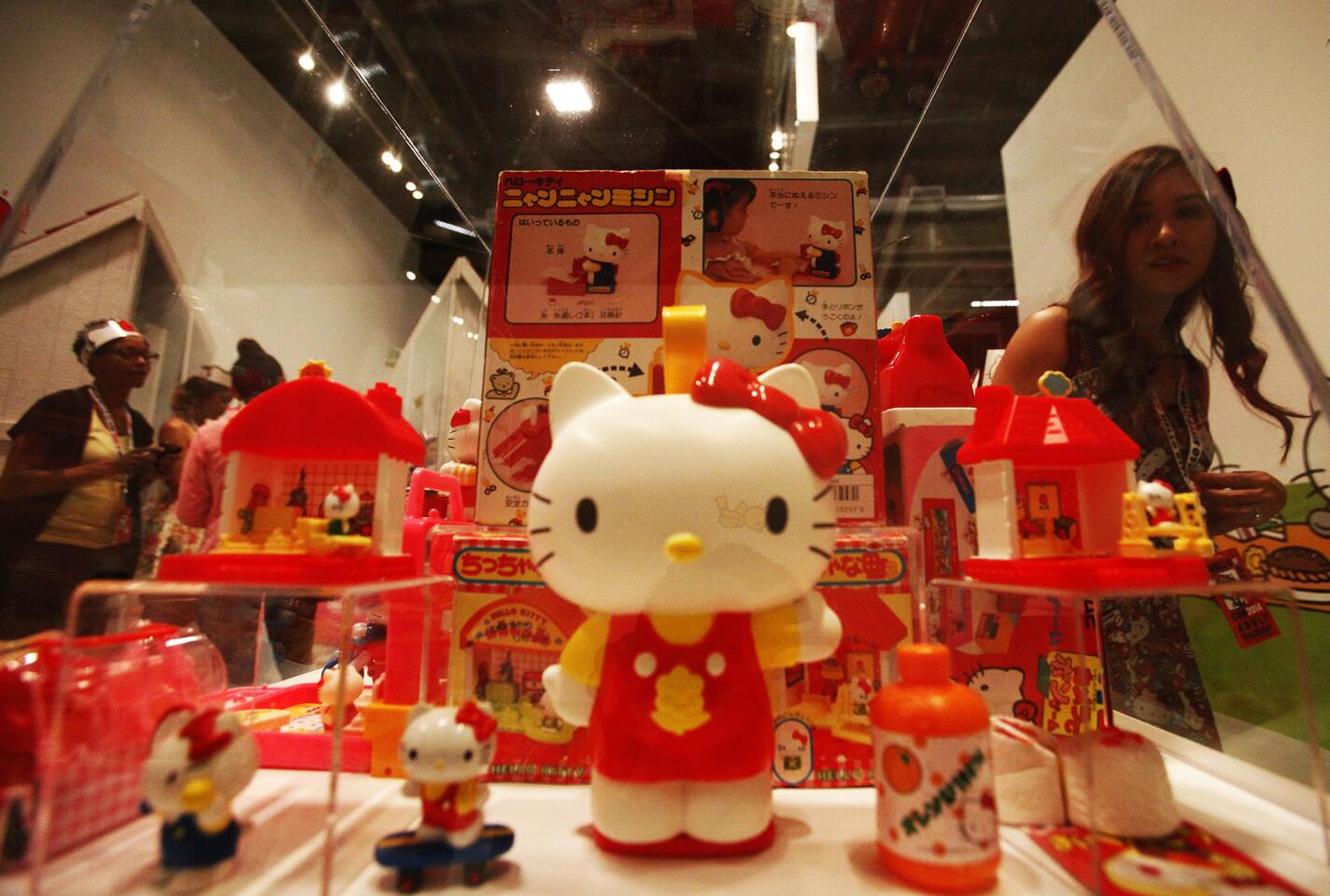 Visitors photograph and observe one of many displays at the Hello Kitty Con 2014 at The Geffen Contemporary at MOCA in Los Angeles.
