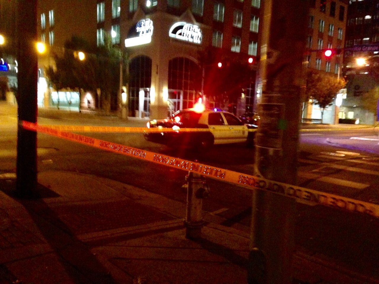 Police tape marks off the scene after authorities shot and killed a man who they say opened fire on the Mexican Consulate, police headquarters and other downtown buildings in downtown Austin, TX.