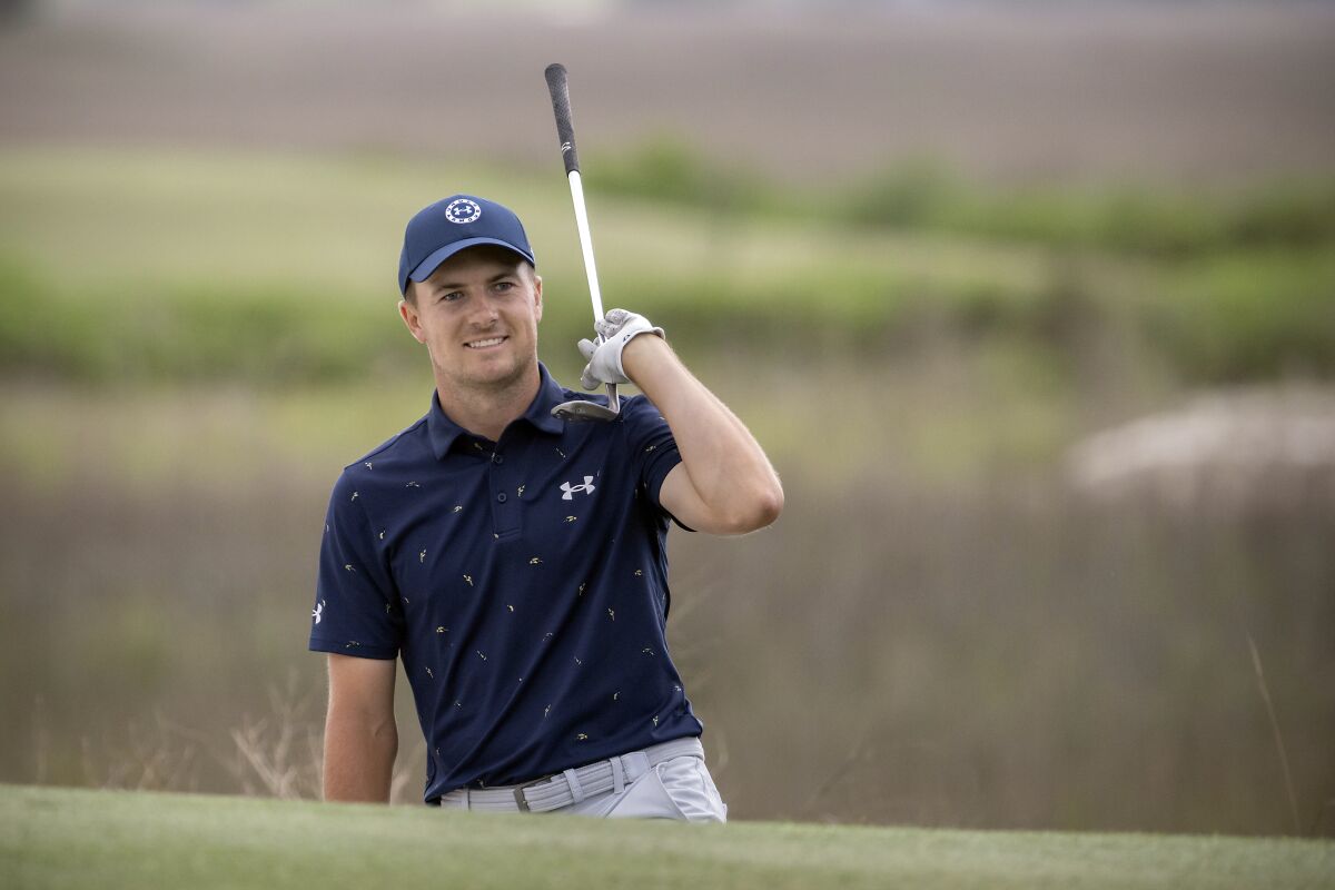 FILE - Jordan Spieth celebrates from the front bunker after chipping in at the 18th hole during the final round of the RBC Heritage golf tournament, Sunday, April 17, 2022, in Hilton Head Island, S.C. (AP Photo/Stephen B. Morton, File)