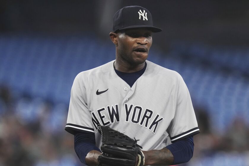 New York Yankees starting pitcher Domingo German walks off the field following the second inning of the team's baseball game against the Toronto Blue Jays on Tuesday, May 16, 2023, in Toronto. (Chris Young/The Canadian Press via AP)