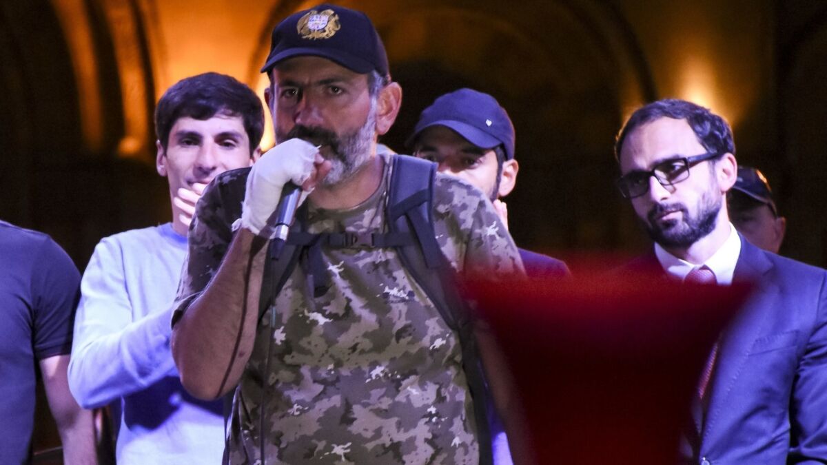 Armenian protest leader Nikol Pashinian, center, speaks to protesters gathered at Republic Square in Yerevan on April 25.