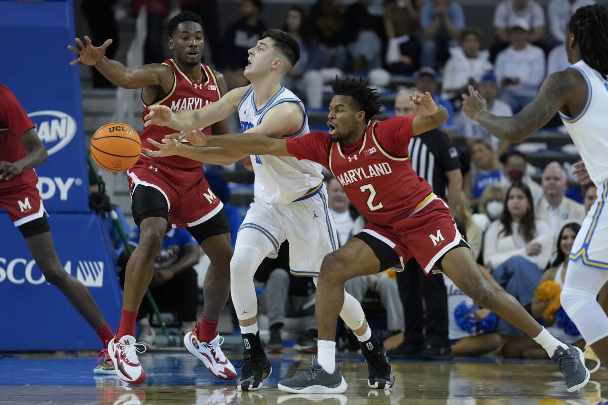 Maryland guard Jahari Long knocks the ball out of the hands of UCLA guard Lazar Stefanovic.