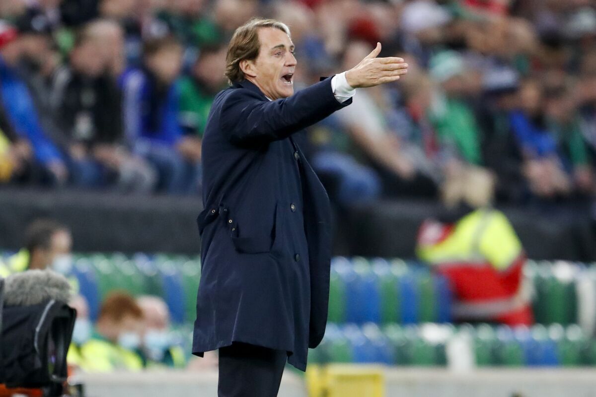 Italy's head coach Roberto Mancini gestures during the World Cup 2022 group C qualifying soccer match between Northern Ireland and Italy at Windsor Park stadium in Belfast, Northern Ireland, Monday, Nov. 15, 2021. (AP Photo/Peter Morrison)