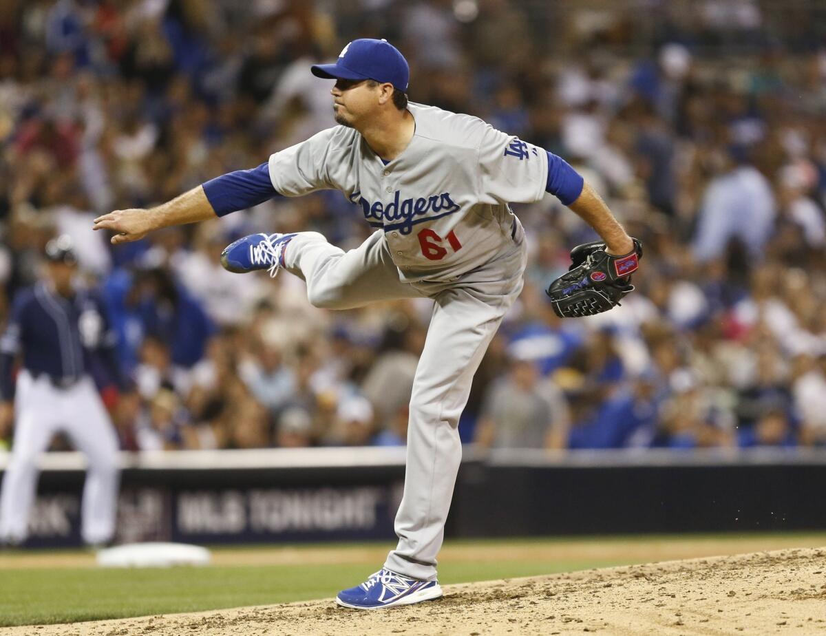 Josh Beckett scattered four hits over seven innings while striking out a season-high eight batters in a 4-2 win Saturday over the San Diego Padres.
