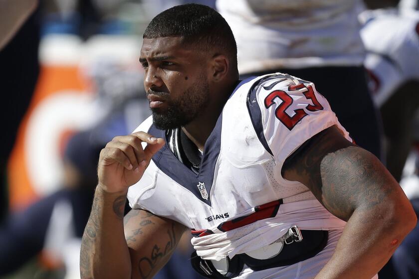 The Houston Texans' Arian Foster sits on the bench during a game against the Oakland Raiders on Sept. 14 in Oakland.