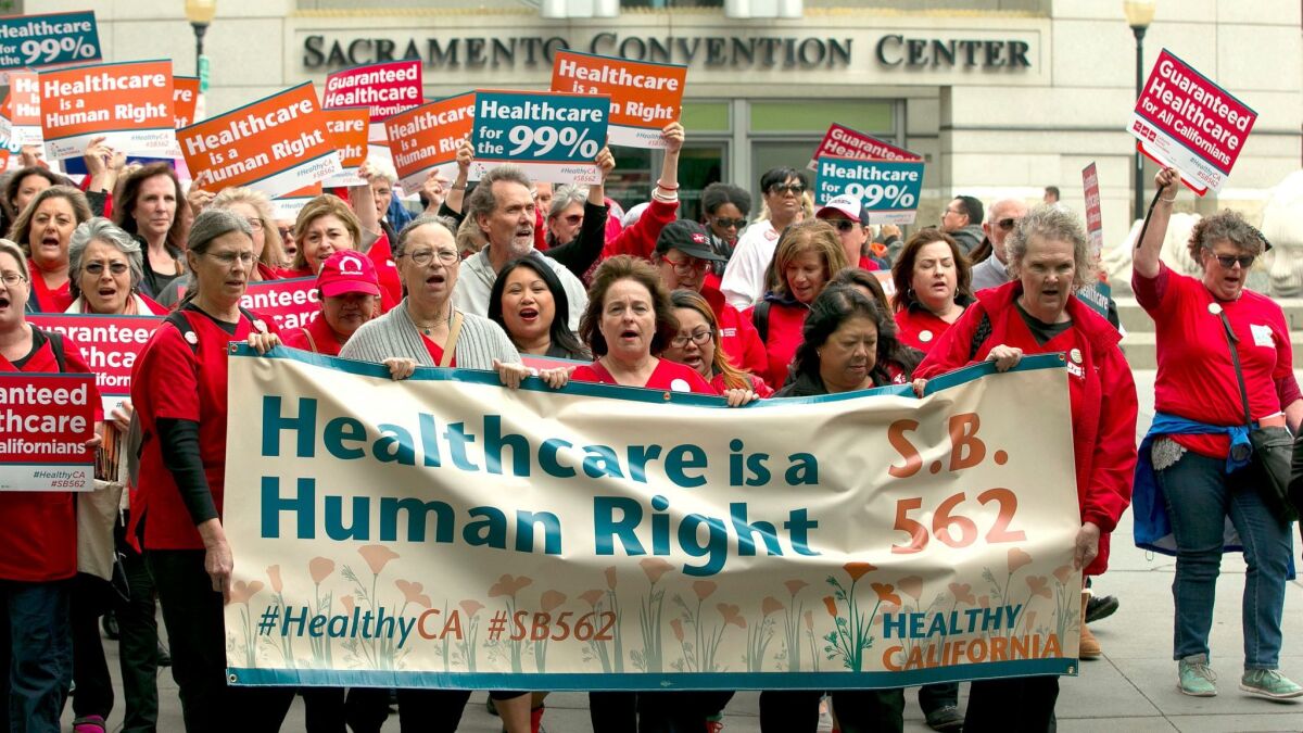 Supporters of single-payer healthcare march to the Capitol building in Sacramento on April 26.