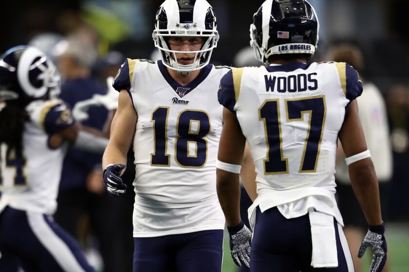 ARLINGTON, TEXAS - DECEMBER 15: Cooper Kupp #18 and Robert Woods #17 of the Los Angeles Rams warm up before a game against the Dallas Cowboys at AT&T Stadium on December 15, 2019 in Arlington, Texas. (Photo by Ronald Martinez/Getty Images)
