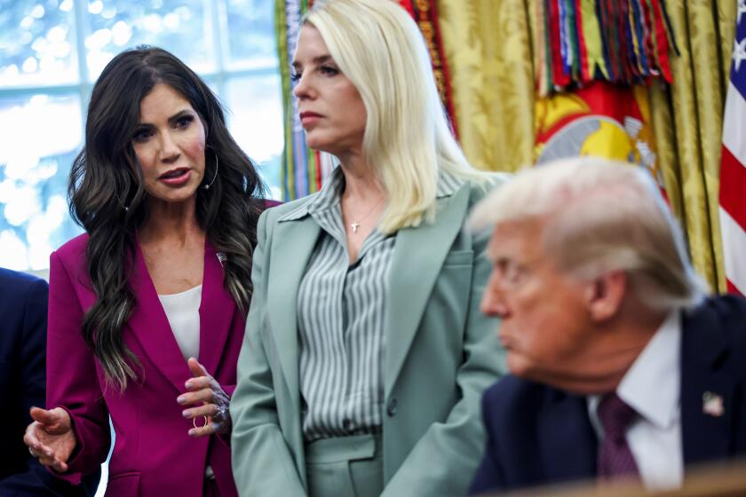 Kristi Noem, secretary of the US Department of Homeland Security (DHS), from left, Pam Bondi, US attorney general, and US President Donald Trump during a memorandum signing in the Oval Office of the White House in Washington, DC, US, on Monday, Sept. 15, 2025. Trump approved a National Guard deployment to Memphis, expanding the federal government's efforts to crack down on what he has cast as out-of-control crime in Democratic-run cities. Photographer: Samuel Corum/Sipa/Bloomberg via Getty Images