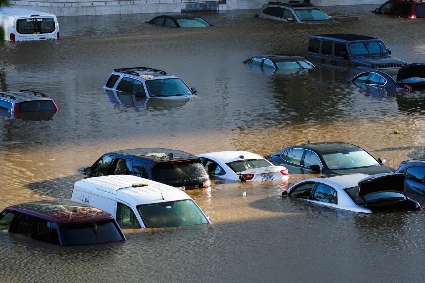 Vehicles are under water during flooding in Philadelphia, Thursday, Sept. 2, 2021 in the aftermath of downpours and high winds from the remnants of Hurricane Ida that hit the area. (AP Photo/Matt Rourke)
