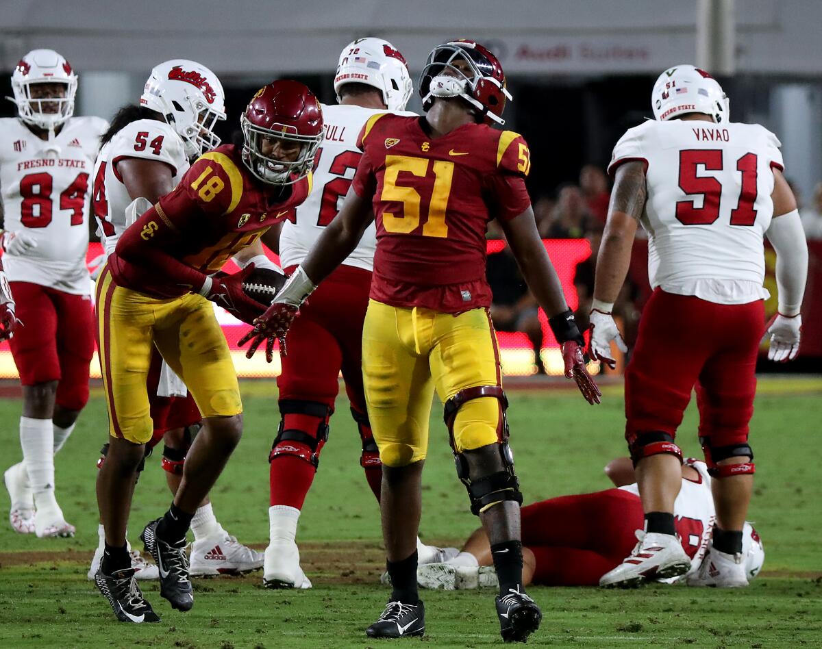 USC defensive lineman Solomon Byrd (51) celebrates after recovering a fumble by Fresno State quarterback Jake Haener.