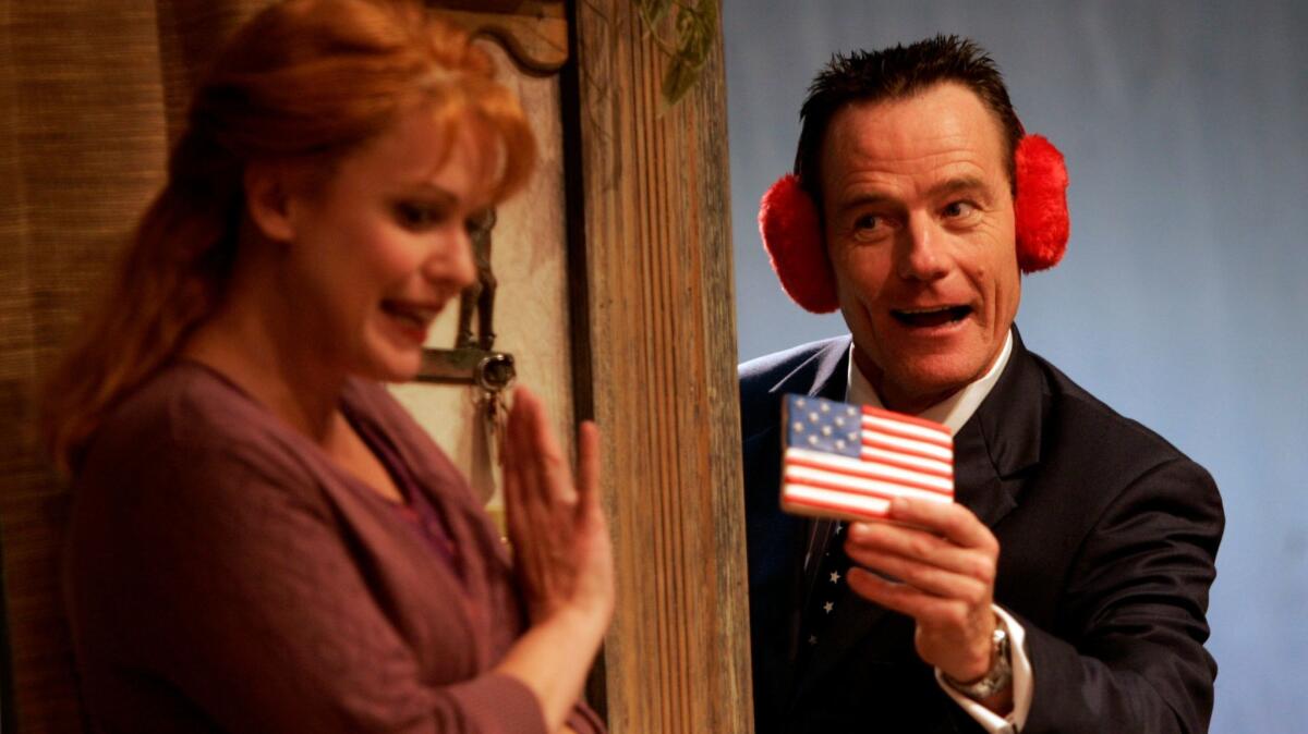 Sarah Knowlton and Bryan Cranston are shown in Sam Shepard's dark political comedy "God of Hell."