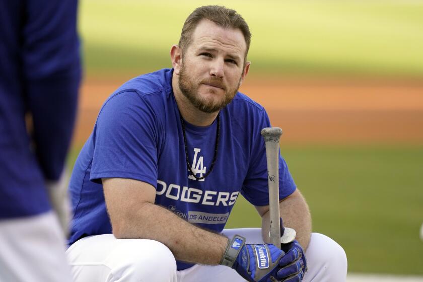 Dodgers' Max Muncy takes a seat during batting practice 
