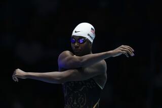 Simone Manuel stretches before a Women's 100 freestyle semifinals heat Tuesday.
