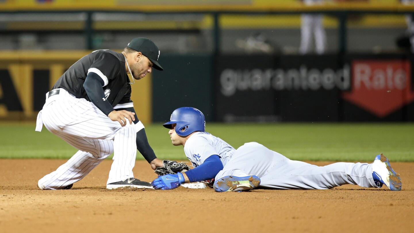 Los Angeles Dodgers center fielder Trayce Thompson beats the throw to White Sox second baseman Yoan Moncada at second base in the sixth inning at Guaranteed Rate Field on July 19, 2017.