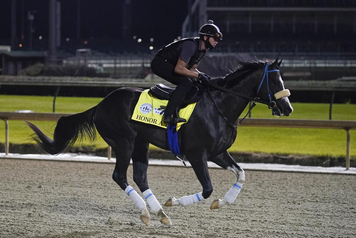 Kentucky Derby entry Honor A.P. runs during a workout at Churchill Downs on Friday.