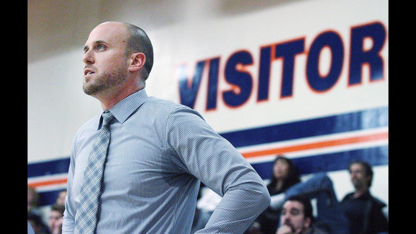 St. Francis head coach Todd Wolfson watches a shot during the game in a boys' basketball game against Chaminade at Chaminade High School in Canoga Park on Monday, Feb. 8, 2016. Last year ended Coach Wolfson's successful 7-years of coaching at the school, and this was his first time back.