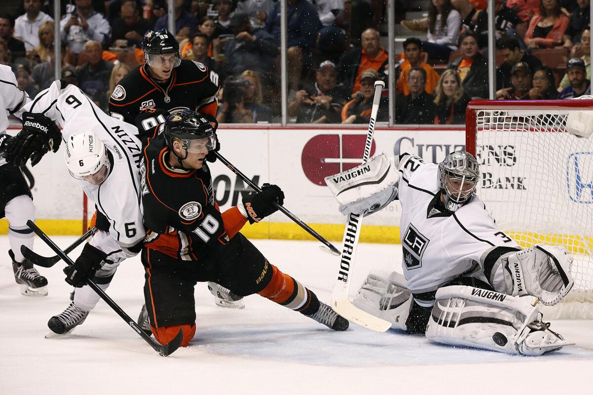 Ducks right wing Corey Perry tries to score against Kings defenseman Jake Muzzin and goalie Jonathan Quick during a Game 7 loss to the Kings in last season's playoffs.
