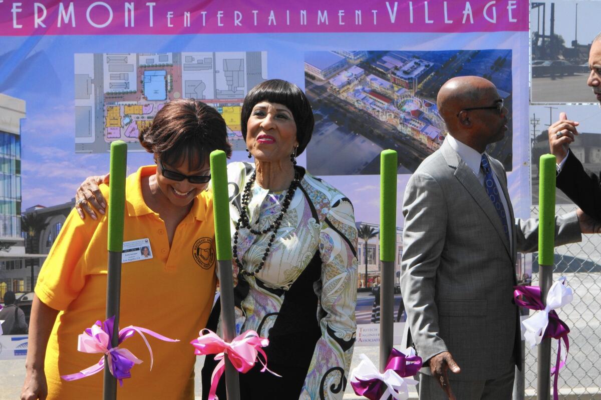 Karen Lawrence, left, and Dr. Betty Price at a groundbreaking ceremony Wednesday at the corner of Vermont and Manchester avenues, where an entertainment district is planned.