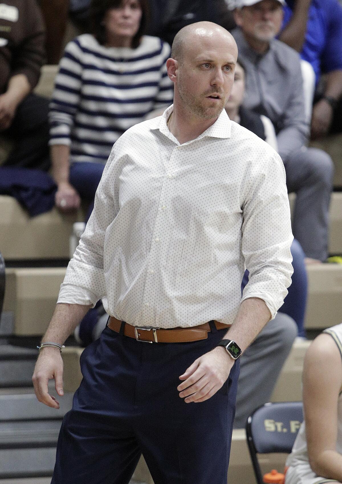 St. Francis' head coach Todd Wolfson walks the sidelines late in the game against Birmingham in a CIF State Division II Southern California Regional boys' basketball quarterfinal at St. Francis High School on Thursday, March 5, 2020. St. Francis won the basketball by keeping the game just out of reach from Birmingham with free throws in the closing minutes of the game.