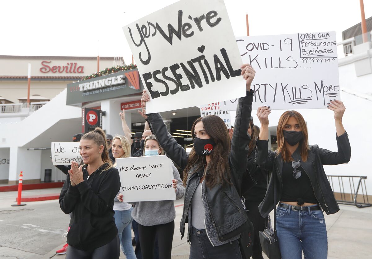 Restaurant and cosmetic industry employees in a Dec. 7 protest against stay-at-home orders.